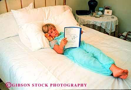 Stock Photo #1889: keywords -  bed bedroom bedrooms book books child comprehend cute girl home horz house in q read reading reads released safe security vision warm