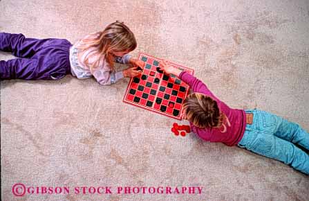 Stock Photo #1895: keywords - checkers children game girls home horz model pair play relax released safe together