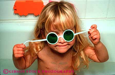 Stock Photo #1896: keywords -  bath bathroom bathtub child cute girl glasses horz model play pose released toy