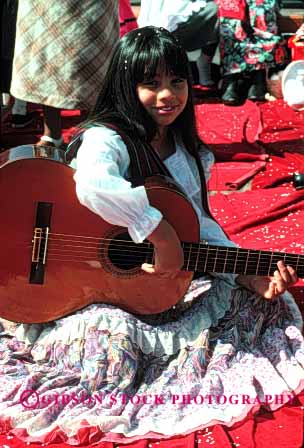 Stock Photo #1903: keywords -  costume dress ethnic float girl guitar hispanic music parade vert