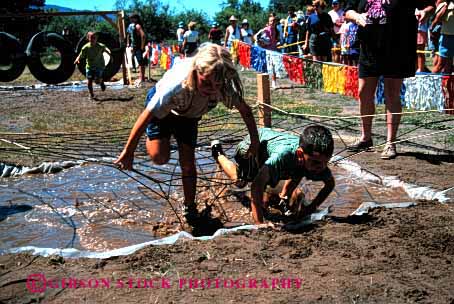 Stock Photo #1910: keywords -  boy children climb competition course crawl dirt girl horz mess mud obstacle play puddle race recreation summer