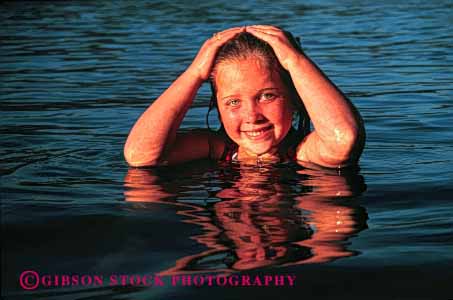 Stock Photo #1912: keywords -  cute eyes face girl head horz model recreation reflection released smile summer swim warm water wet