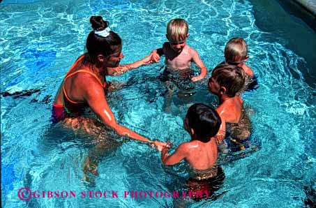 Stock Photo #1918: keywords -  boys child children class cooperate group hands hold horz learn model pool recreation released summer swim teach team together water