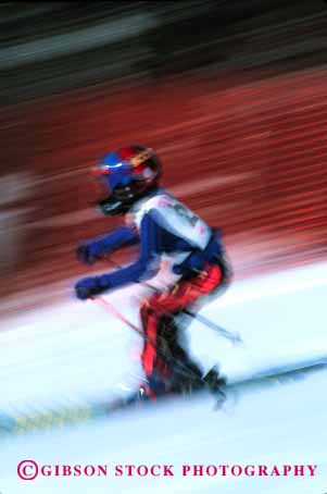 Stock Photo #1921: keywords -  action blur child downhill dynamic fast helmet motion move race ski snow speed sport vert winter