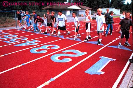 Stock Photo #6044: keywords -  and athlete athletic attempt boy boys child children class competition contest effort elementary field fifth foot grade horz practice race racer racers racing run runner runners running school sport start strength together track try