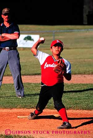 Stock Photo #6047: keywords - african aim american baseball black boy child elementary ethnic grade minority pitcher practice red school sixth skill sport uniform vert