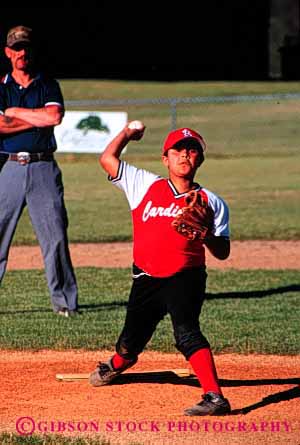 Stock Photo #6047: keywords -  african aim american baseball black boy child elementary ethnic grade minority pitcher practice red school sixth skill sport uniform vert