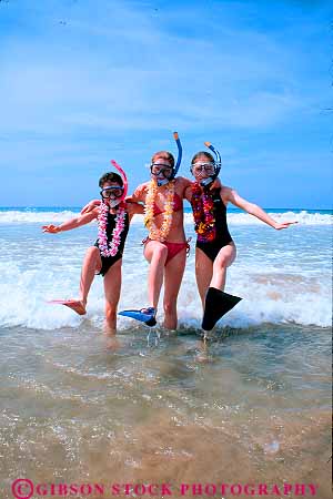 Stock Photo #11412: keywords - beach beaches children destination dive equipment friend friends fun girl girls hawaii in lei leis ocean play playing portrait recreation released sea snorkel splash surf three travel vacation vert water wave waves with