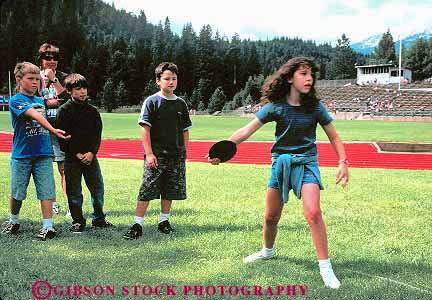 Stock Photo #16768: keywords -  activities activity adolescence adolescent adolescents child children childrens competitive discus disk exercise exercising friend friends friendship fun game games girl girls holding holds horz kid kids meet outdoor outdoors outside people person play playing plays recreation sport sports summer throw throwing throws track young youth
