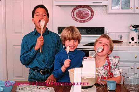 Stock Photo #1937: keywords -  african american bake child children cook ethnic friend group home horz kitchen lick model released spoon together