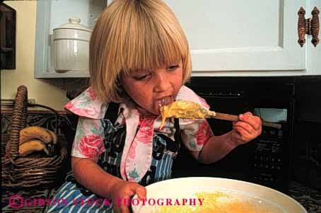 Stock Photo #1939: keywords -  batter child cook cookie cute eat food girl home horz kitchen lick model released taste