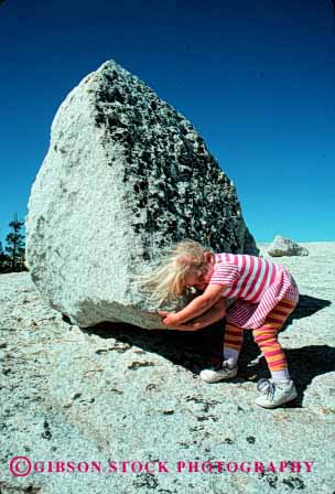 Stock Photo #1944: keywords -  big boulder boulders challenge challenged challenges challenging child children compare compared compares comparing comparison contrast contrasted contrasting contrasts determination differ difference different differing differs difficult effort efforts erratic girl glacier heavy huge impossible job kid kids large lift lifted lifting lifts little persistance pick picks push pushed pushes pushing released resistance rock rocks size sized sizes small summer task tasks tried try trying up vert