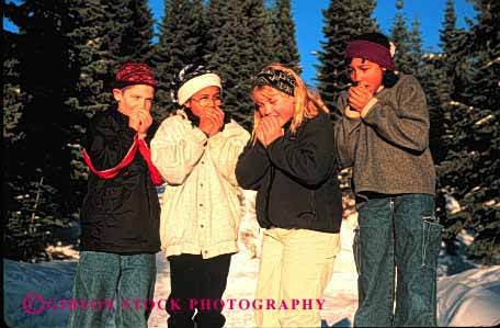 Stock Photo #1956: keywords -  african air american blow blowing blows boy boys breath breathes breathing children chilly cold cupped ethnic fingers four freezing friend friends gender girl girls group groups hand hands horz minority mix mixed mixture model mouth multi nature outdoor outside released small snow team together warm warming warms winter