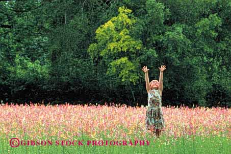 Stock Photo #1959: keywords -  above alone arm arms carefree carolina cute embrace explore expression field flax flower free freedom gesture gestured gestures gesturing girl graceful happy horz in kid kids nature north outdoor overhead people person pretty quiet reach reached reaches reaching released secure security skyward skywards smile solitude spirit spirited spring summer up upward upwards