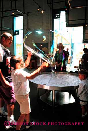 Stock Photo #1967: keywords -  bubble child children childrens create creative elementary fe fun giant girl learn museum not play practice released sante science vert water