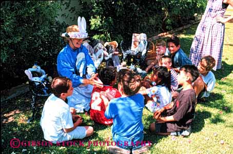 Stock Photo #1970: keywords -  boys child children class classes costumed create creative elementary girls group groups horz kid kids learn not outdoor outside pl play playing plays practice preschool read reading reads released share shares sharing sit sits sitting stories story students summer teacher tell telling tells with young youth