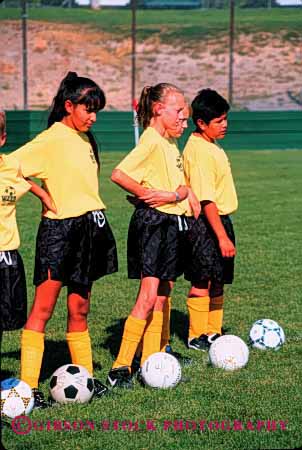 Stock Photo #1980: keywords -  adolescent african american autumn black children ethnic fall friend gender group mix not outdoor play player recreation released share soccer social sport team vert yellow
