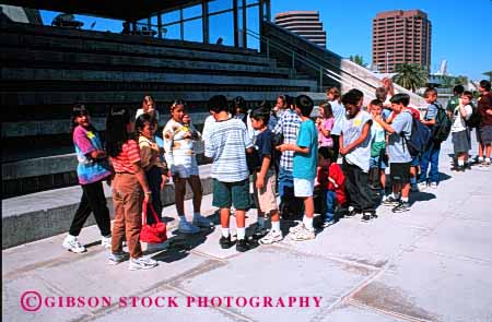 Stock Photo #1981: keywords -  class elementary ethnic field friend gender group horz line mix not outdoor recreation released share social trip wait