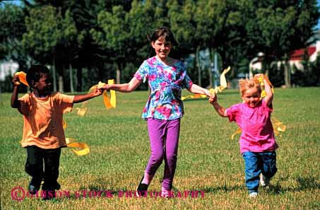 Stock Photo #1983: keywords - african american black boy children ethnic friend gender girl group horz mix model outdoor play playground recreation released run share social team
