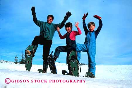 Stock Photo #1986: keywords -  african american asian black boy children ethnic friend gender girl group horz mix model play recreation released share snowshoe social winter