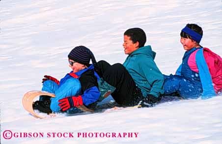 Stock Photo #1990: keywords -  action adolescent adolescents african american asian black blur blurred child children downhill downward ethnic friend friends friendship fun gender gravity group happiness happy horz japanese kid kids mix motion move movement moves moving outdoor play playing recreation released share sled sledding slide slides sliding smile smiles smiling snow social speed toboggan winter youth