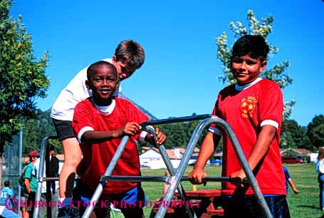 Stock Photo #1998: keywords -  african american black boys climb ethnic friend group hispanic horz mix not outdoor play playground recreation released share social summer three