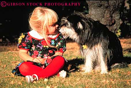 Stock Photo #3351: keywords -  animal children dog feed friend girl horz nose outdoor released