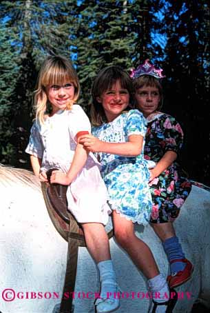 Stock Photo #2002: keywords -  animal chi girls horse ride triplet vert