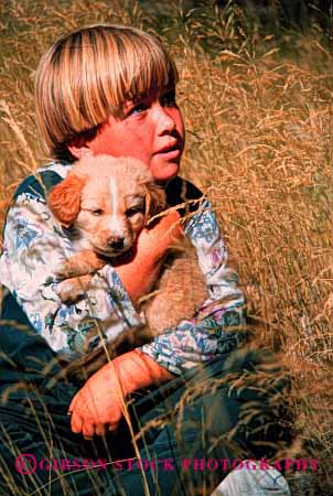 Stock Photo #2003: keywords -  affection animal child children cuddle cuddles cuddling cute dog dogs girl girls happy hold holds hug hugging hugs kid kids love model pet pets puppies puppy released touch vert young