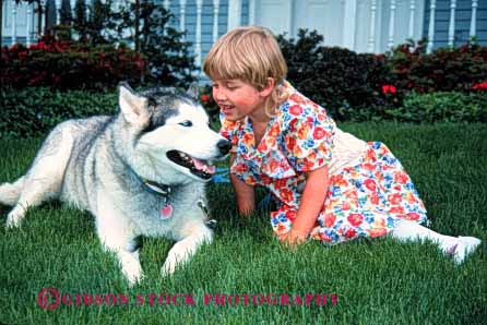 Stock Photo #2012: keywords -  affection animal child dog fur girl happy home horz husky love mammal released talk touch with