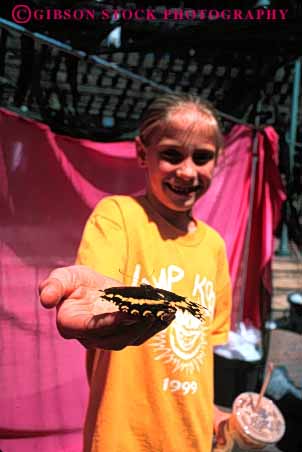 Stock Photo #6090: keywords -  adolescence adolescent animal butterfly child embrace finger gentle girl hand hold insect light outdoor play summer vert wing wings young