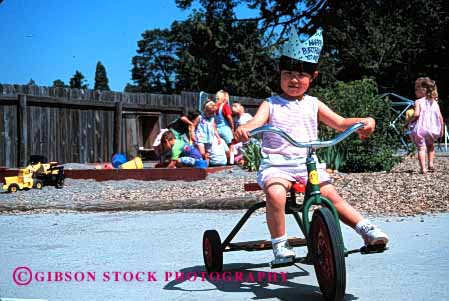 Stock Photo #2017: keywords -  asian bike bikes birthday child children daycare development education ethnic girl girls hat horz japanese kid kids learn outdoor outdoors outside play playground playgrounds playing plays preschool released ride rider rides riding social summer teach tricycle tricycles yard