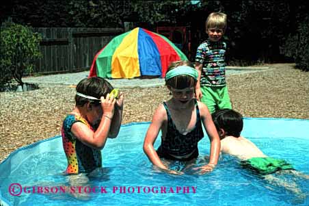 Stock Photo #2020: keywords -  boy caution child children cool danger daycare development education fun girl horz in kid kids learn play playground playgrouns playing plays pool pools preschool refresh refreshing released risk risky shallow social summer swim swimming teach water wet yard