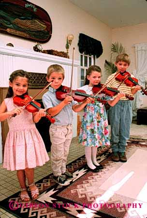 Stock Photo #2022: keywords -  boy child children cute girl group harmony home instrument music playing practice released skill social sound string vert violin violins