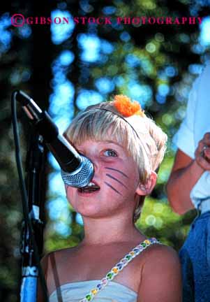 Stock Photo #2024: keywords -  child children concert cute face girl girls into kid kids microphone music musical musician nouth outdoor perform performing released show sing singer singers singing sings skill song sound summer vert vocal voice