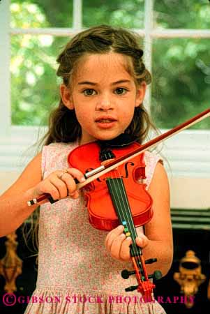 Stock Photo #2025: keywords - child children girl girls harmon home instrument instruments kid kids lesson lessons musical musician play playing plays practice practices practicing released skill sound string stringed vert violin violins youth