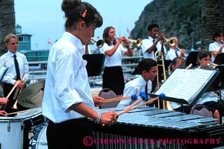 Stock Photo #6088: keywords - adolescence adolescent band child children girl group harmony hit horz instrument music musical musician noise outdoor percussion perform performance performer play sound summer tap together xylophone young