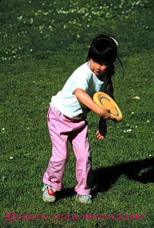 Stock Photo #2036: keywords -  asian child ethnic frisbee girl not outdoor play recreation released sport summer throw vert