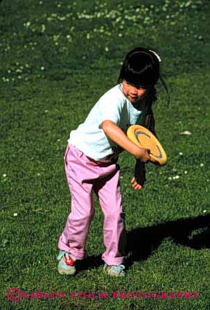 Stock Photo #2036: keywords - asian child ethnic frisbee girl not outdoor play recreation released sport summer throw vert