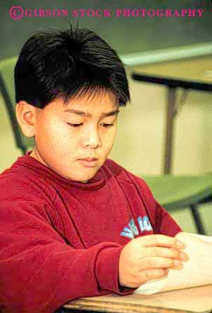 Stock Photo #2037: keywords -  asian attention boy boys child children chinese class concentrates concentrating education elementary ethnic forth fourth grade japanese kid kids read reader reading reads released school student students study studying vert