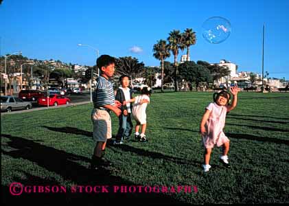 Stock Photo #2040: keywords -  asian beach boy brother bubble child children chinese ethnic girl horz laguna not play reach released sister