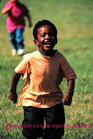 Stock Photo #2042: keywords -  african american black boy child ethnic exercise game happy healthy model outdoor released run smile vert