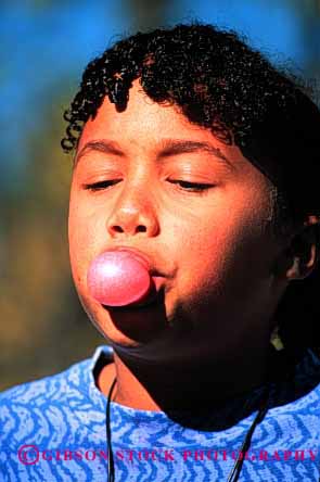 Stock Photo #2044: keywords -  african american black bubble child ethnic face food game girl gum healthy model released vert