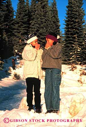 Stock Photo #2045: keywords - adolescents african american black blow blowing blows breath breathes breathing child children chilly cold ethnic fingers freezing girls hand hands in kid kids model mouth outdoor outdoors outside released sister snow twin vert warm warming warms winter youth