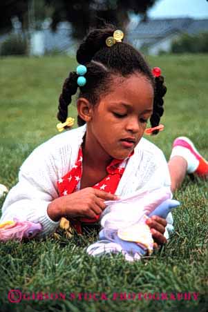 Stock Photo #2047: keywords - african american black brush child comb doll ethnic game girl hair healthy model outdoor play relax released vert