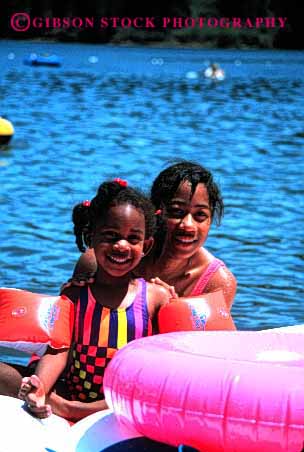 Stock Photo #2048: keywords - african american black child children couple ethnic exercise friends game girls happy healthy lake model outdoor released sisters smile swim together vert water