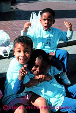 Stock Photo #2049: keywords - african american black child children elementary ethnic field friends game happy not outdoor released school shirt smile trip uniform vert wrestle