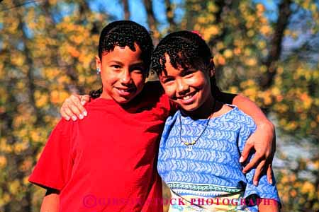 Stock Photo #2051: keywords -  affection afric african american black buddies child children embrace embraced embraces embracing ethnic friend friends friendship girl girls happy healthy horz hug hugging hugs identical kid kids love model outdoor released sibling siblings sisters smile smiles smiling summer together twin twins