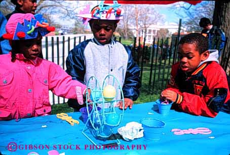 Stock Photo #2055: keywords - african american black child children dc easter egg ethnic game happy healthy holiday horz house not outdoor released smile washington white