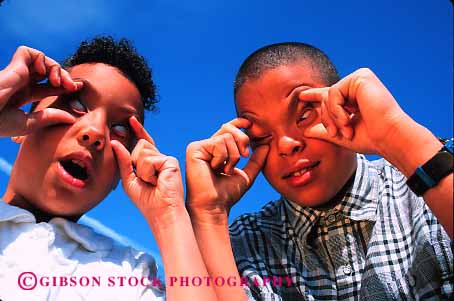 Stock Photo #2057: keywords -  african american black boy child distort ethnic eyes face game girl happy horz make model outdoor released smile weird